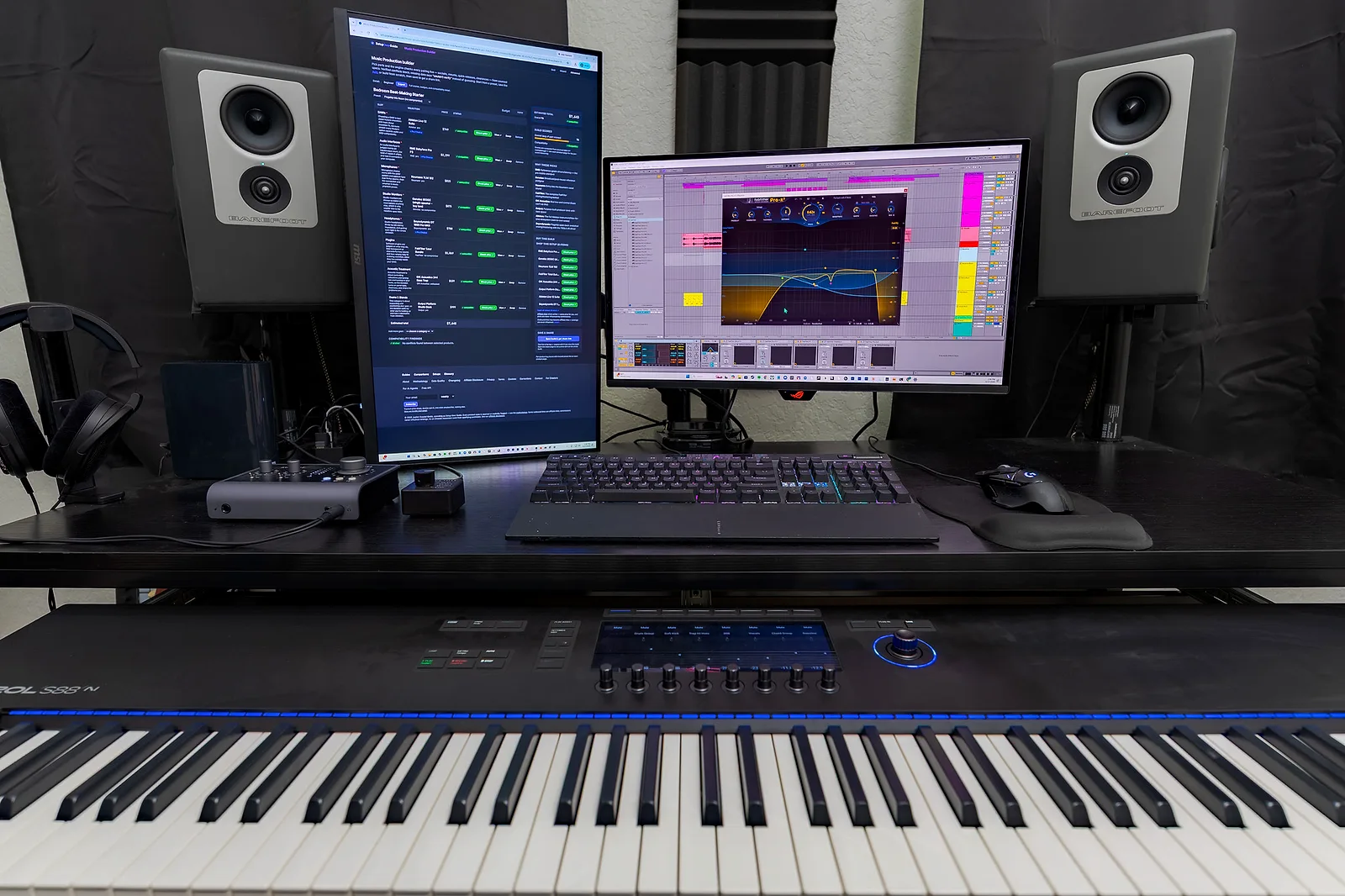 A 10×10 home music studio: two Barefoot Footprint 02 Gen 2 monitors flanking dual displays, a Komplete Kontrol S88 keyboard below, and an Audient iD14 on the desk